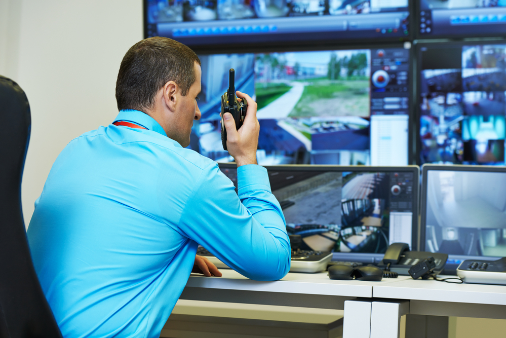 Security officer looking at monitors