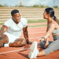 Two people stretching before run