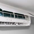 Home air conditioner with open lid for repair and cleaning